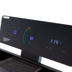 Treadmill console displaying time, speed, and distance on a dark panel with blue LED readouts.