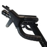 Close-up of a black bicycle handlebar with textured grip and brake/shift lever on a stem.