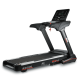 Black treadmill with a large digital console, safety key, and red accents, labeled RS1000 RS Line Pro Series.