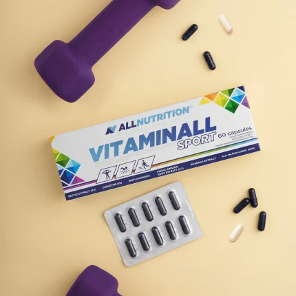 All Nutrition VitaminAll Sport box with capsules and blister pack on a yellow background with purple dumbbells nearby