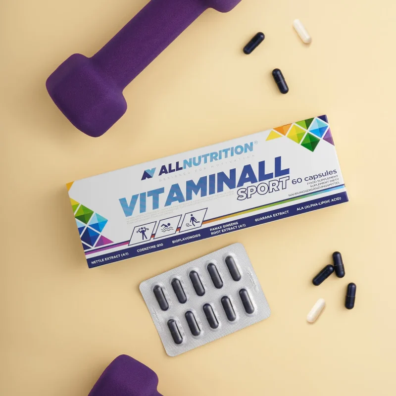 All Nutrition VitaminAll Sport box with capsules and blister pack on a yellow background with purple dumbbells nearby