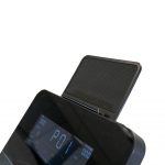 Close-up of a black exercise machine console with a small fold-out shelf above the digital display.