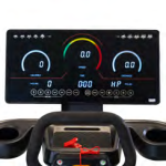Fitness machine control panel with two circular gauges and a central digital readout between handles on a black console.