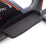 Close-up of a textured black foot pedal on an elliptical/cross-trainer with ridged grip edges for stability during workouts.