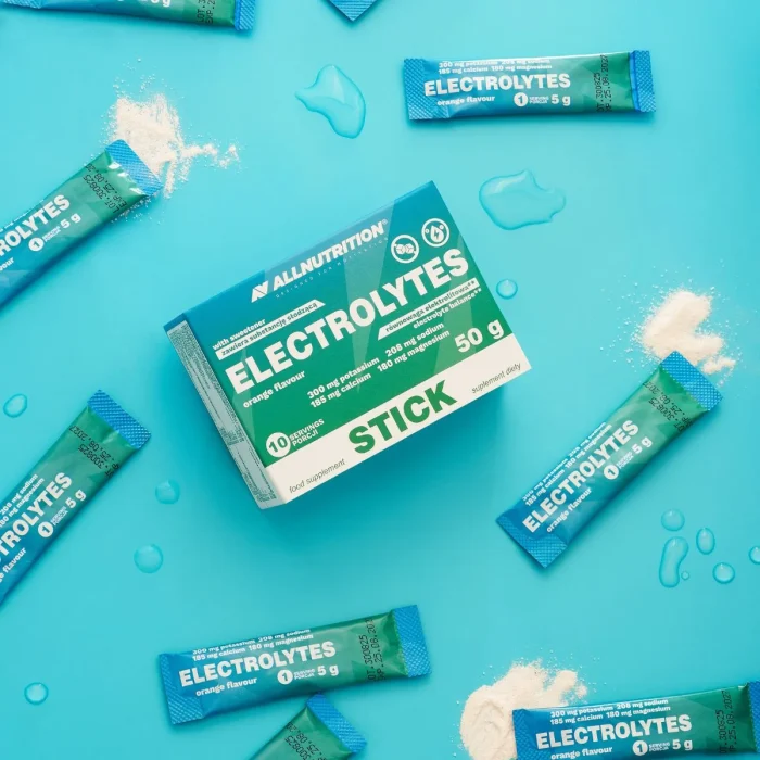 ALLNUTRITION ELECTROLYTES STICK orange flavour box with individual sachets scattered on a blue background