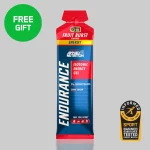 Energy gel pouch labeled 'Fruit Burst' flavor with 23 g carbohydrates and zero sugar; green 'Free Gift' badge in the corner and a sport‑tested badge nearby.