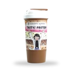 Protein shaker bottle labeled 'Tasty! Protein' with a cheering cartoon character on the wrap, chocolate-brown drink visible inside.